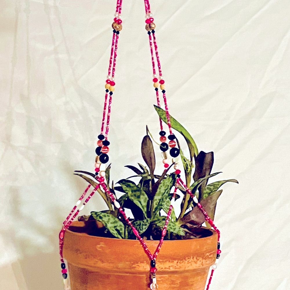 Hand beaded hanging plant holder measures Approx 32” long